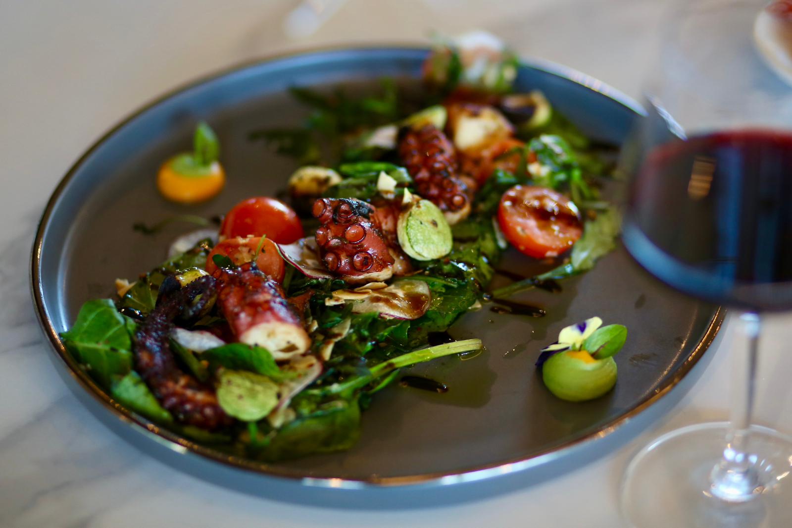 Mussels in broth with edible flowers