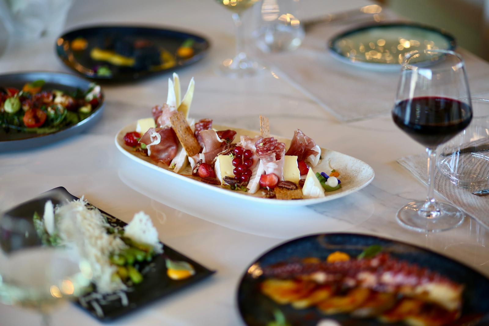 Squid ink pasta with seared salmon and cherry tomatoes