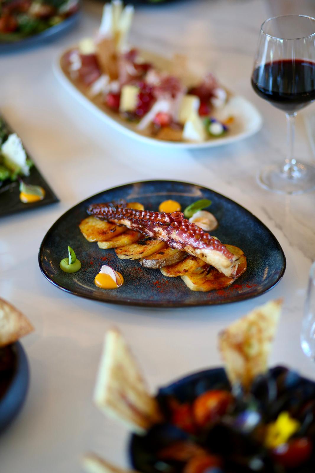 Tomahawk steak with rosemary on dark slate
