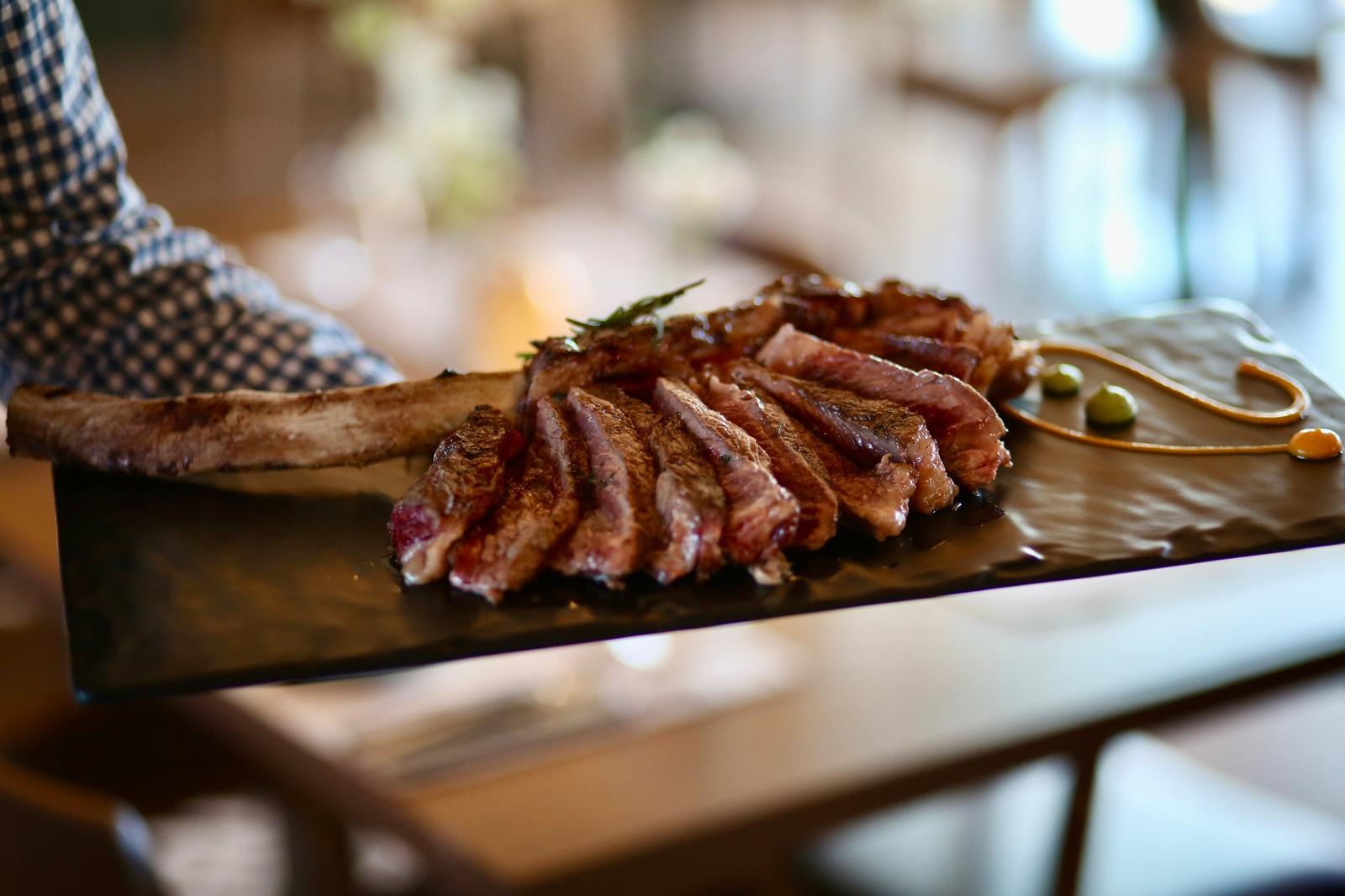 Squid ink tagliatelle with salmon cubes close-up